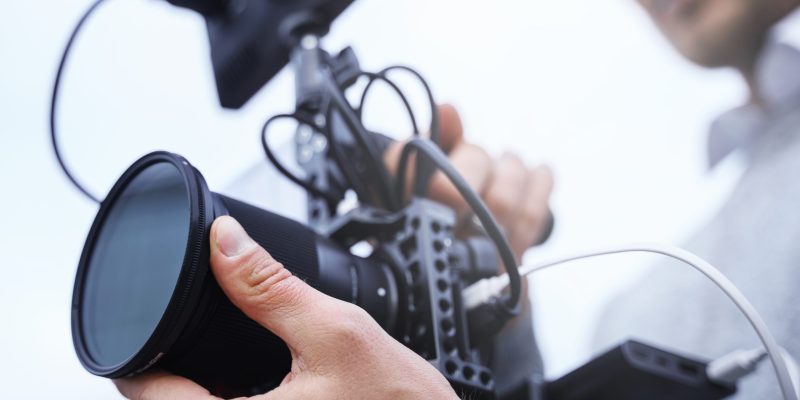 Videographer with a modern camera rig for video recording